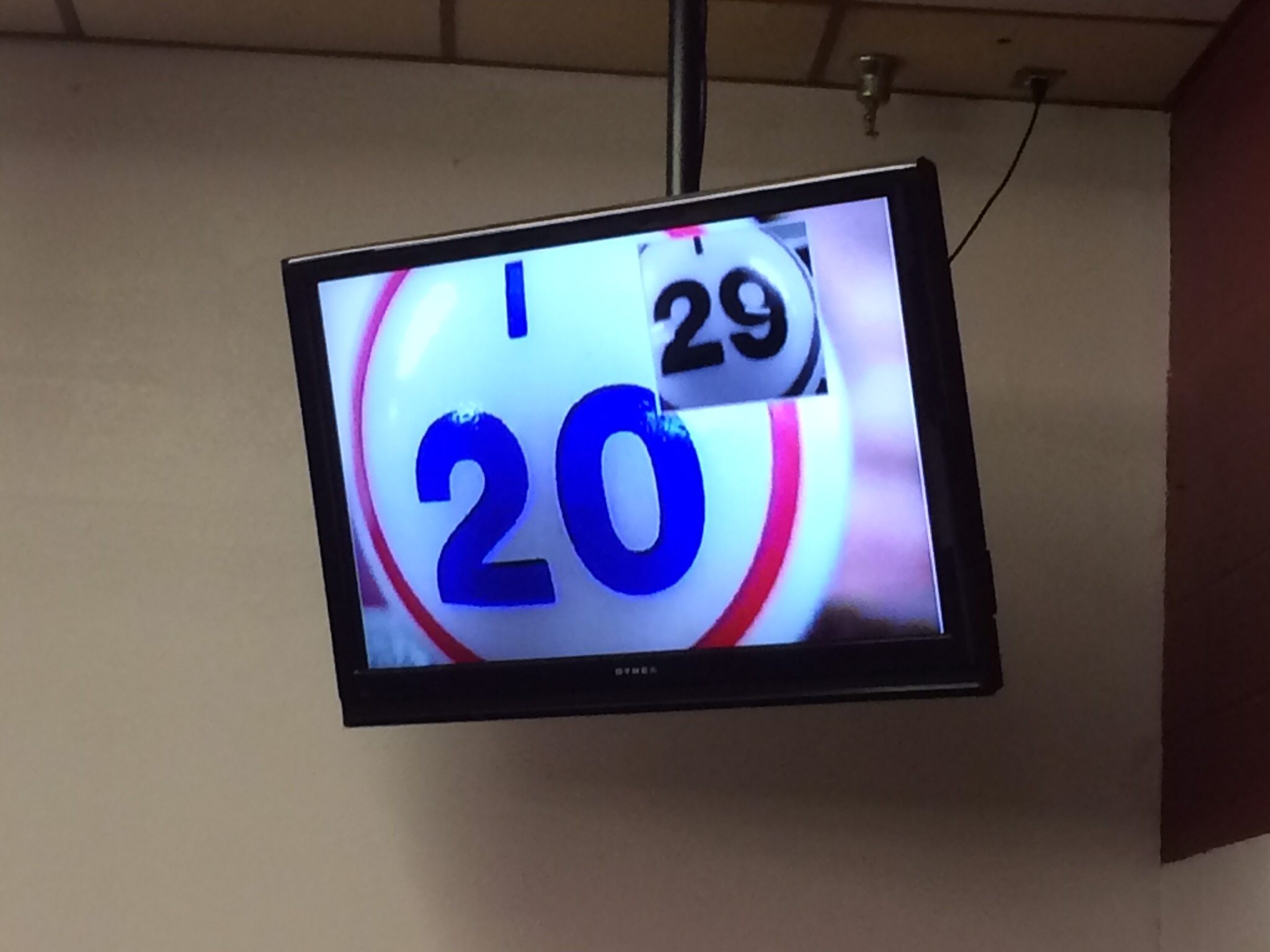 Hall monitor with a large I 20 bingo ball and a smaller I 29 ball in the corner